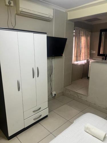 Postel nebo postele na pokoji v ubytování Triple T Guest house