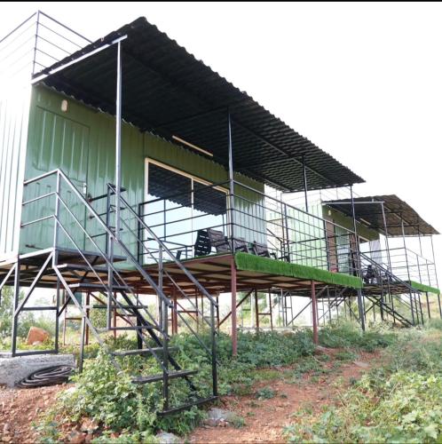 a large building with a balcony on top of it at Birds of paradise foundation in Bangalore