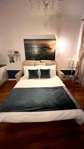 a bedroom with a large white bed with two pillows at Marcel Zadar Old Town in Zadar