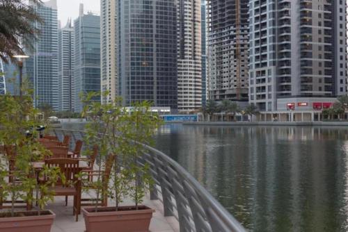 a view of a city with buildings and a body of water at Click Stay - JLT - Studio & Balcony Lakes view Entire Apartment -RA in Dubai