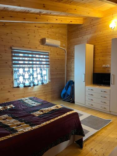 a bedroom with a bed and a window at Apartment 040 in Velipojë
