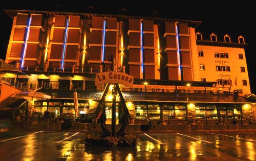 a building with a sign in front of it at night at Hotel Gran Casona de Sanabria in Puebla de Sanabria