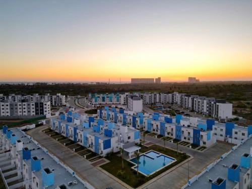 an aerial view of an apartment complex at sunset at Casa Regina in Gallinero