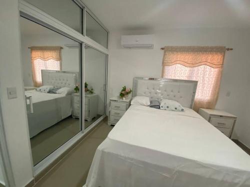 Katil atau katil-katil dalam bilik di Apartamento en Puerto Plata, en Los Maestros