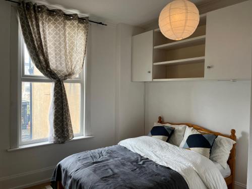a bedroom with a bed and a window at shardeloes in London