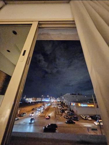 a view of a city street at night from a window at استديو. الياسمين للإيجار اليومي و دخول ذاتي. in Riyadh