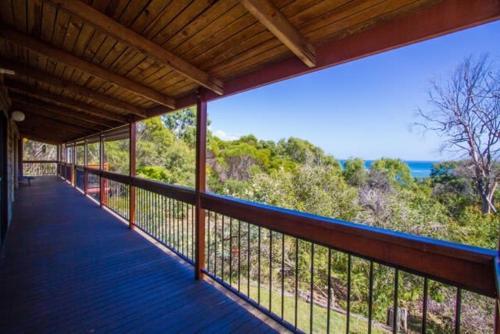 a balcony of a house with a view of the ocean at Bimbimbi - Unique Two-Bedroom, Serene Holiday Hideaway with Gorgeous Views in Historic 1770 in Seventeen Seventy