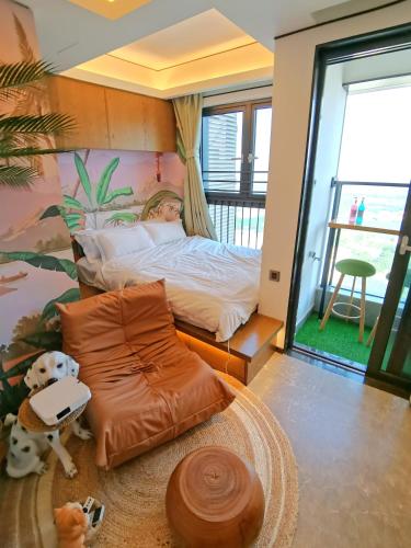 a boy laying in a bed in a bedroom at Interact China Fine Condo - Shenzhen Bay in Shenzhen