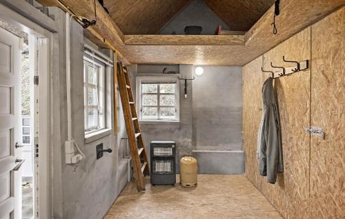 a small bathroom with a ladder and a shower at 2 Bedroom Cozy Home In Haarby in Hårby