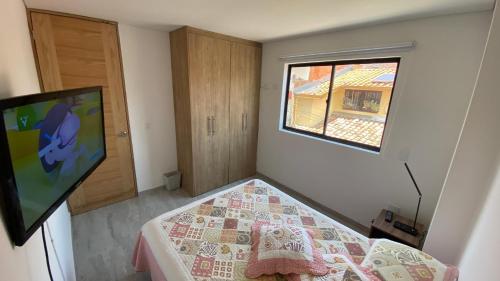 TV a/nebo společenská místnost v ubytování Apartamento Centro Marinilla