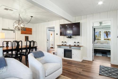 a living room with a couch and a dining room at Hill Country Mirage in Bandera