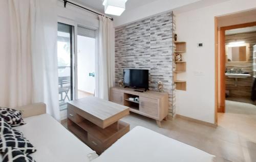 a living room with a couch and a tv at Gorgeous Apartment In Rota With Wifi in Rota