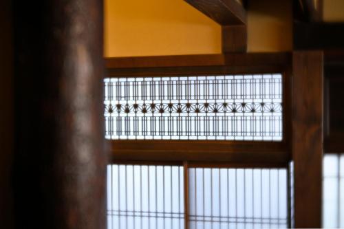 a close up of a window in a building at Kyoto Fushimi Sutekichi Private Hotel in Fushimi