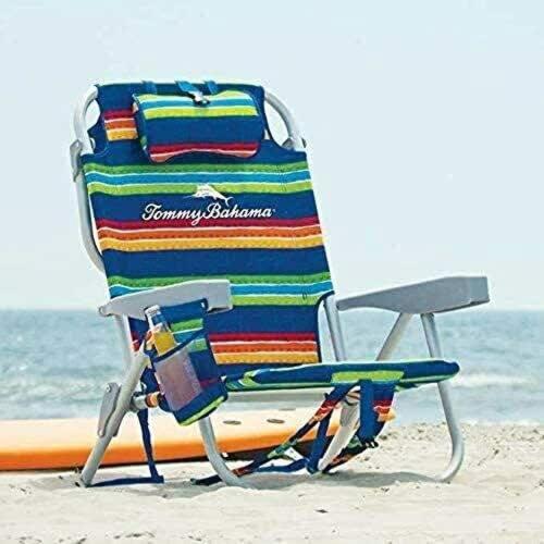 a colorful beach chair sitting on the beach at Gold coast elegance with private pool in Noord