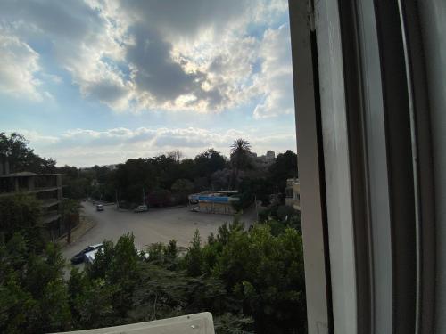 a view from a window of a parking lot at Mahitab music in Cairo
