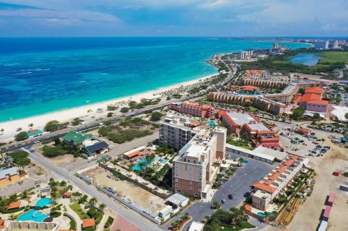 an aerial view of a resort and the beach at Beautiful apartment in eagle beach levent in Palm-Eagle Beach