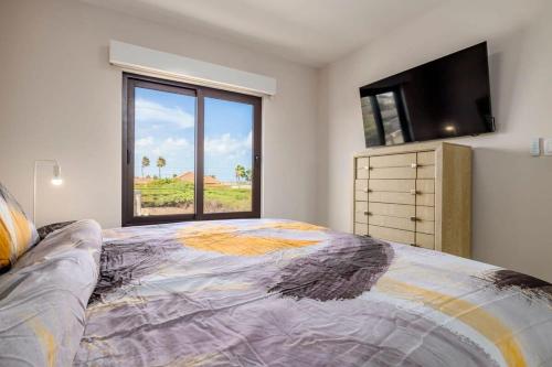 a bedroom with a large bed with a large window at Special studio apartment in gold coast in Noord
