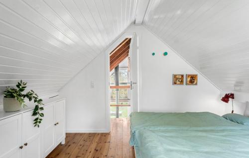 a white room with a bed and a window at 3 Bedroom Cozy Home In Mern in Mern