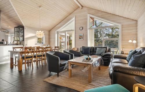 a living room with a couch and a table at Nice Home In Glesborg With Wifi in Glesborg