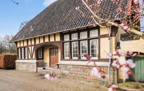 a yellow and black house with a door at 5 Bedroom Cozy Home In Næstved in Næstved