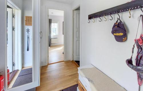 a hallway with a white wall and a hallway with a hallway at 3 Bedroom Beautiful Home In Hörby in Hörby