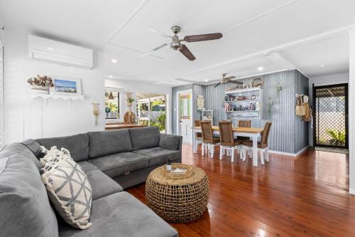 a living room with a couch and a table at The Bridge Walk in Manyana