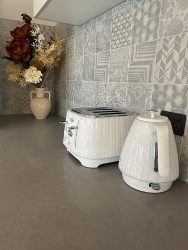 a toaster sitting on a counter in a kitchen at The Bloom in Seaspray