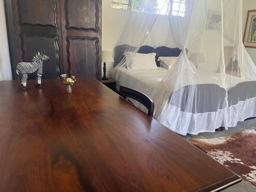 Postel nebo postele na pokoji v ubytování Kruger Park Farmstay near Orpen Gate