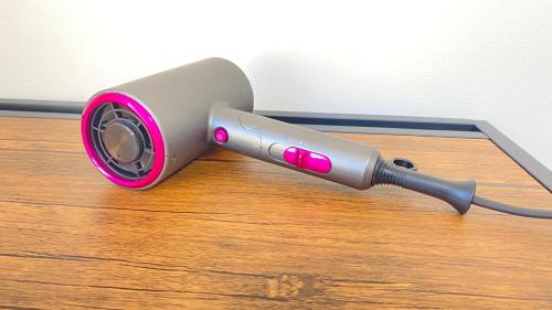 a hair dryer sitting on top of a wooden floor at CON-TWO 201 in Tokyo