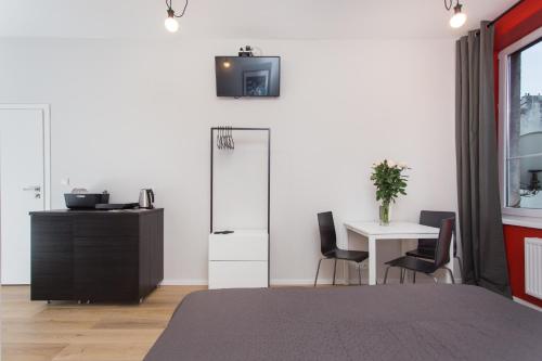 Телевизор и/или развлекательный центр в Krakow B&B
