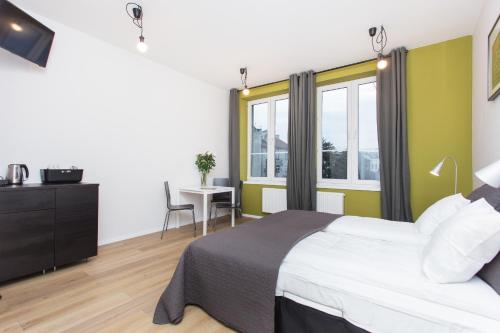 Кровать или кровати в номере Krakow B&B