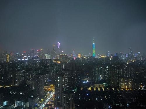 a view of a city at night with at Guangzhou City Inn Hotel Apartment Changgang in Guangzhou