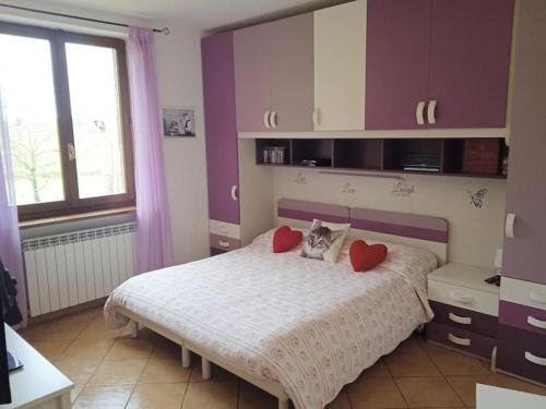 Un pat sau paturi într-o cameră la Villetta con parco vicino San Gimignano