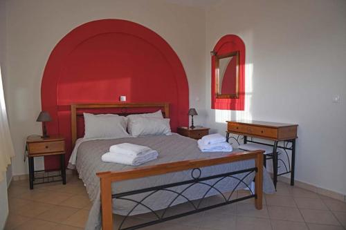 Tempat tidur dalam kamar di Villa Christina