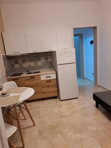 Kuchyň nebo kuchyňský kout v ubytování Aggeliki apartment