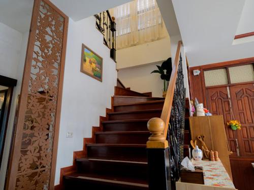 a staircase in a home with a stair case at โมเมนต์ แอ๊ท ริมโขง in Chiang Khan