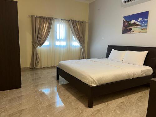 Ένα ή περισσότερα κρεβάτια σε δωμάτιο στο Fins Guest House