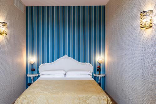 Voodi või voodid majutusasutuse Hotel Atlanta Augustus toas