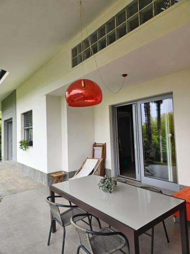 a dining room with a table and chairs at Villa in Precollina in Turin