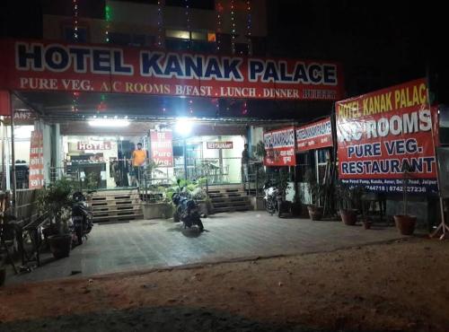 a hotel kawasaki palace with motorcycles parked in front at Hotel Kanak Palace in Jaipur