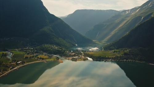 an aerial view of a lake in a mountain valley at Skjolden Resort in Skjolden