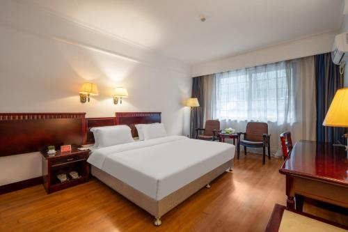 Hunan New Pipaxi Hotelにあるベッド