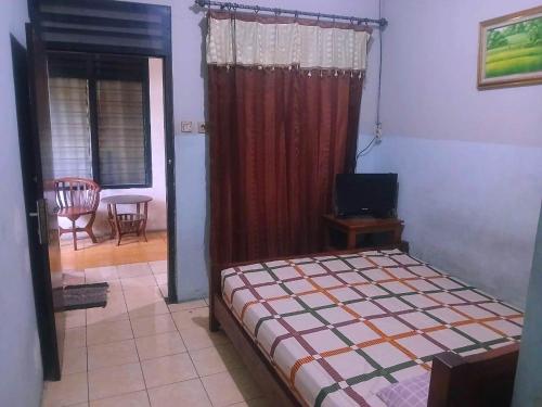 Ένα ή περισσότερα κρεβάτια σε δωμάτιο στο Hotel Pelangi HS