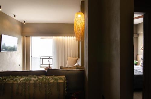 Ένα ή περισσότερα κρεβάτια σε δωμάτιο στο Sea front Elegant Apartment