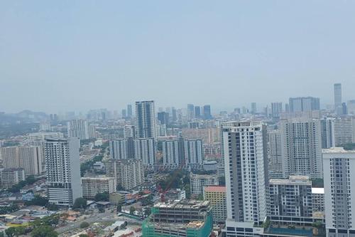 an aerial view of a city with tall buildings at Aesthetic Urban Suite With Infinite Pool & Gym in Jelutong