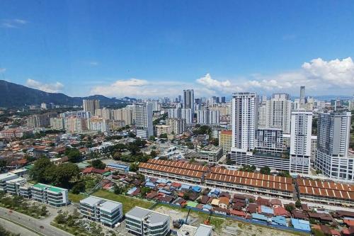 an aerial view of a city with tall buildings at Aesthetic Urban Suite With Infinite Pool & Gym in Jelutong