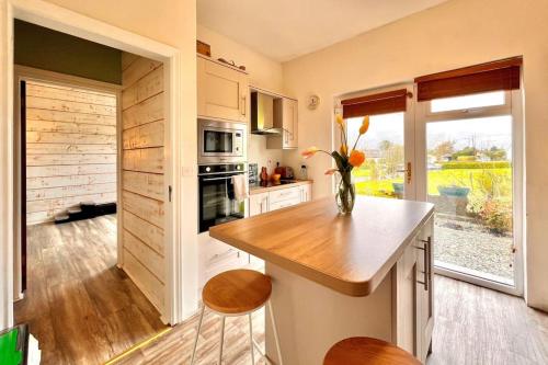 a kitchen with a vase of flowers on a counter at Moate - One Bedroom Self Contained Apartment in Moate