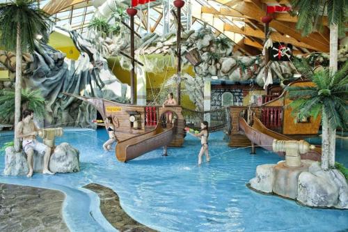a group of people playing in a water park at Miabella House - 2 bedrooms and terrace in Brežice