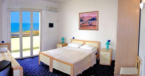 Postel nebo postele na pokoji v ubytování Medi Garden Hotel&Residence