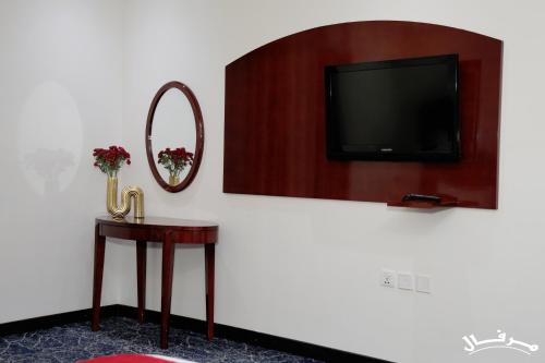 Μια τηλεόραση ή/και κέντρο ψυχαγωγίας στο Merfal Serviced Apartments Royal